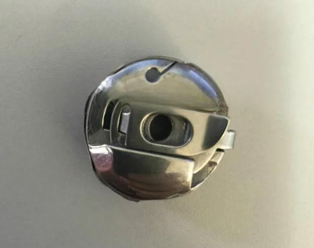 cleaned-164691 ZSK L-Sized Bobbin Case with NBL Spring – Genuine Embroidery Machine Spare Part - Image 1